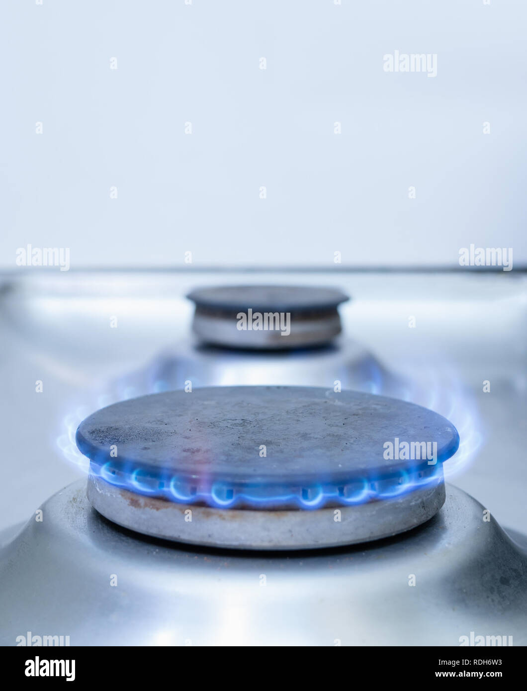 closeup of one stove gas burner with blue flame Stock Photo Alamy