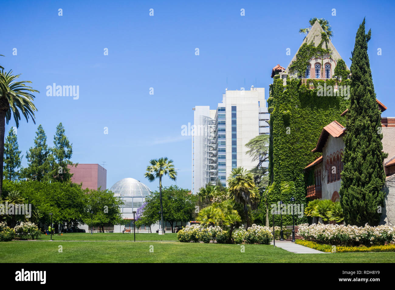 Old building at the San Jose State University; the modern City Hall building in the background
