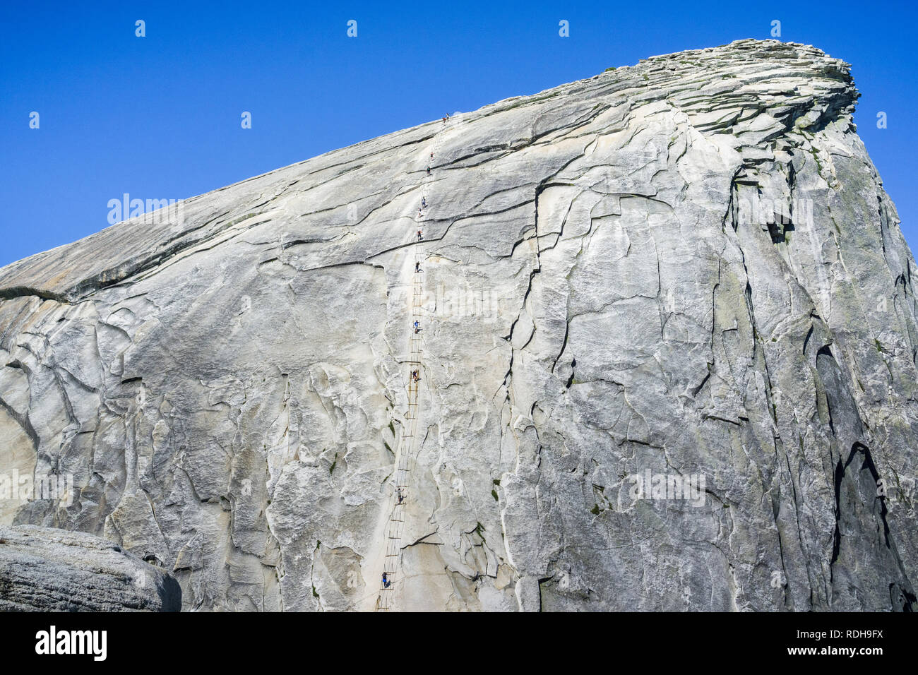 Going up on the Half Dome cables on a sunny summer day, Yosemite National Park, California Stock Photo