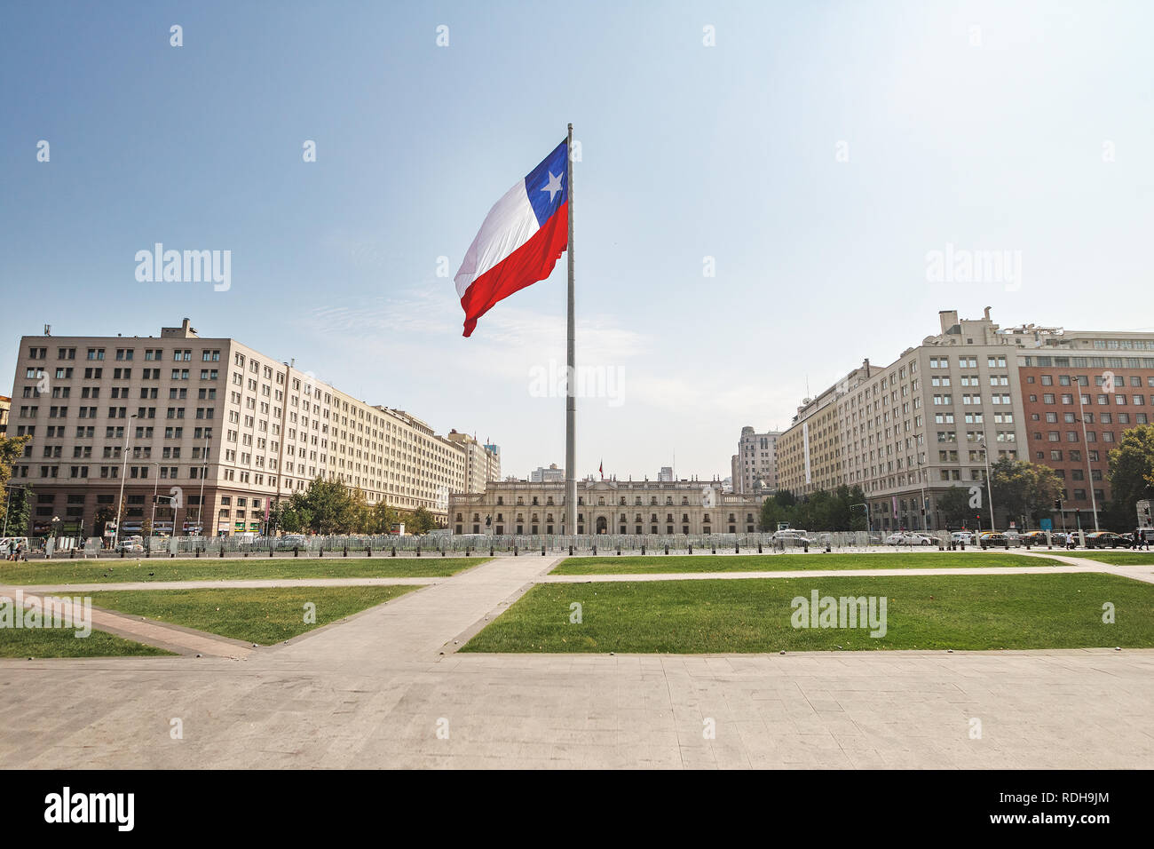 La Moneda Palace and Bicentenario Chilean Flag - Santiago, Chile Stock Photo