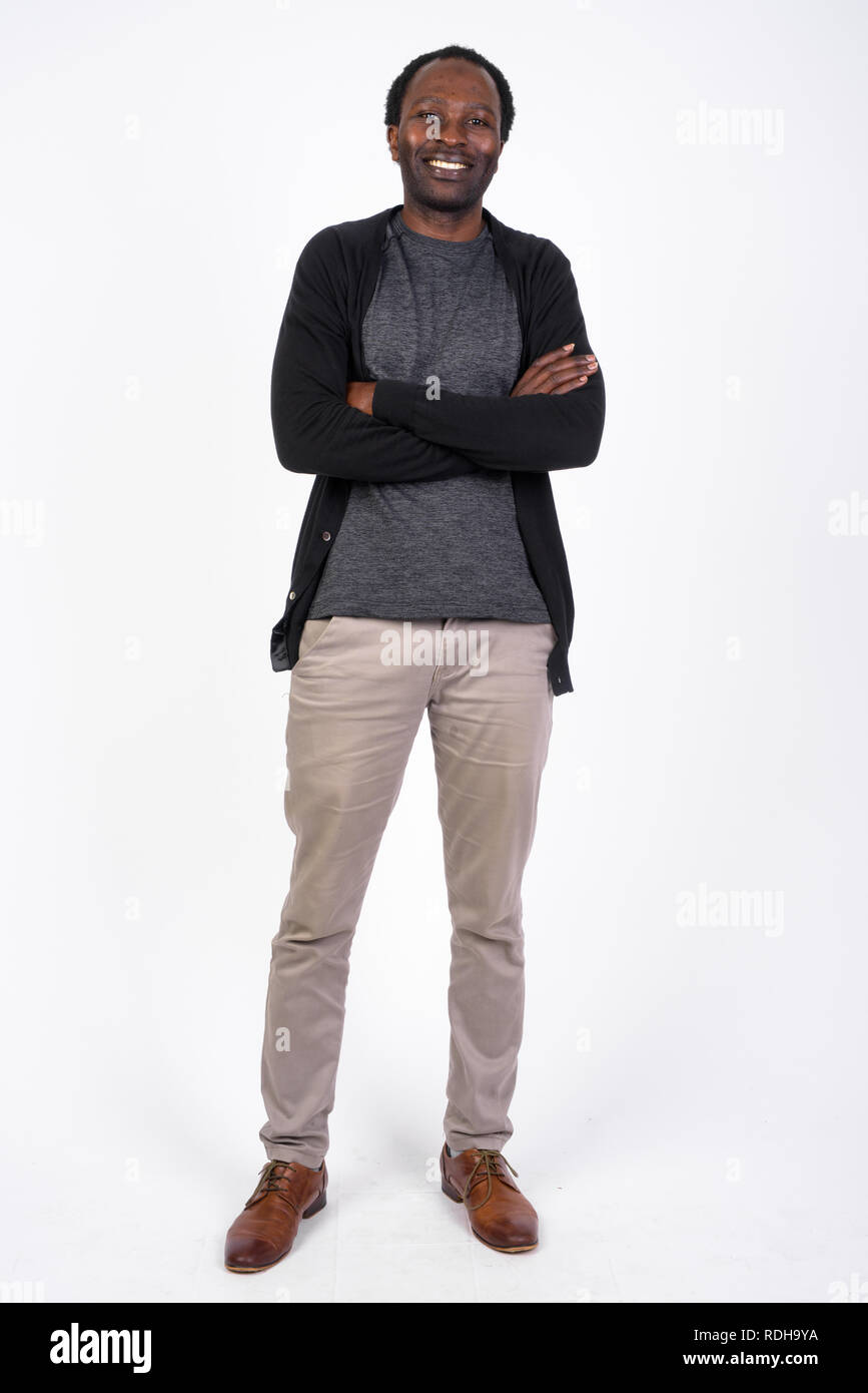 Full body shot of happy African man smiling with arms crossed Stock ...