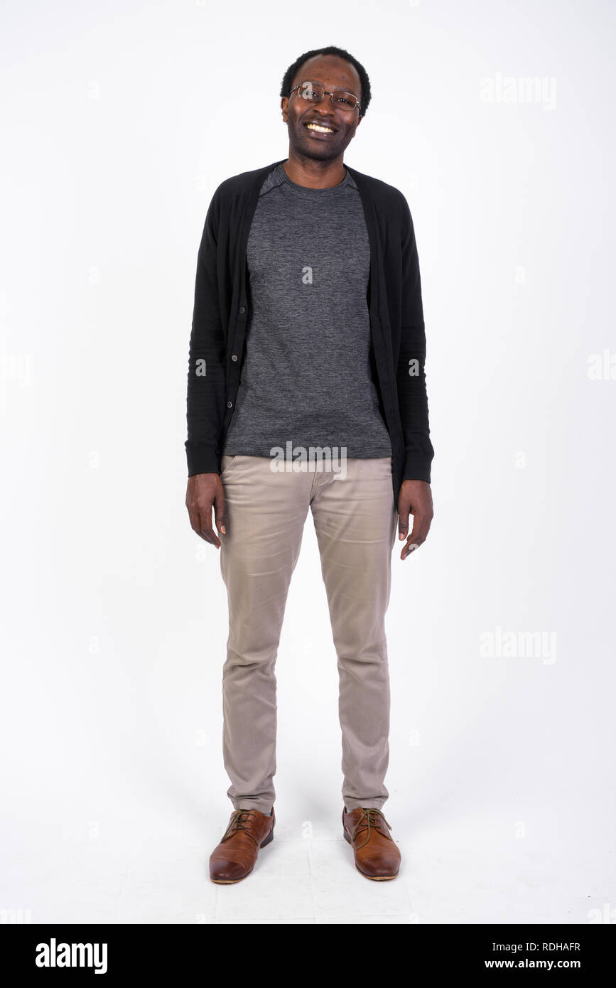 Full body shot of happy African man smiling Stock Photo - Alamy