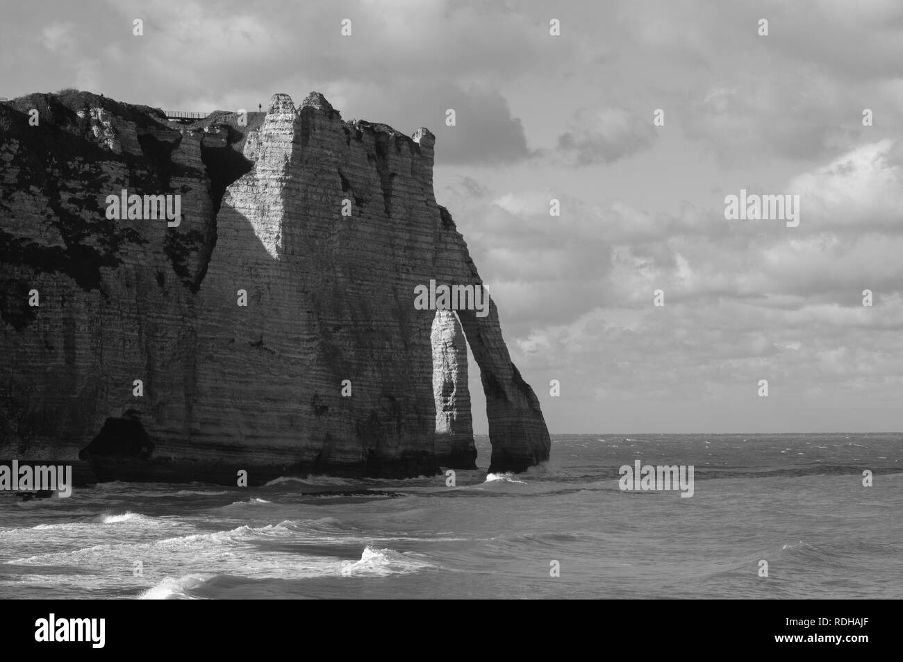 Famous natural cliffs in Etretat. Etretat is a commune in Seine-Maritime department in Haute-Normandie region in France. Stock Photo