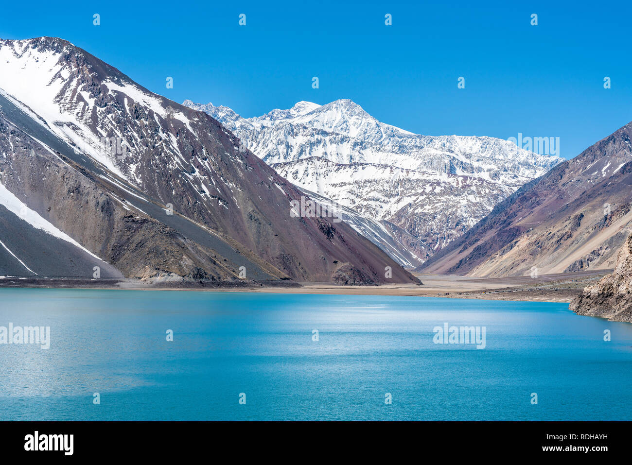 Embalse del Yeso (Yeso Dam) awe high altitude turquoise waters lake inside an amazing rugged landscape. Steep mountains on an awe scenery Stock Photo