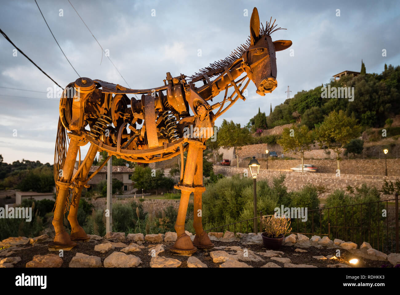 ESTELLENCS, SPAIN - OCT 5, 2018:  Scrap metal sculpture arts - a figure of a horse made out of trash in village Estellencs, Mallorca island, Spain Stock Photo