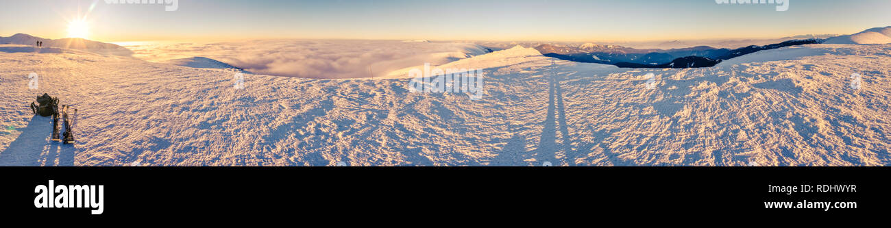 Breathtaking panorama of sunrise from the peak of mountains in Slovakia with beautiful cloud inversion. Stock Photo