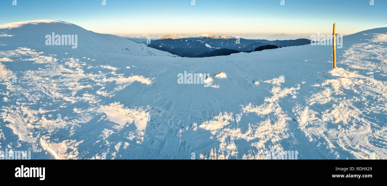 Panorama of winter in mountains of Slovakia on sunny morning. Stock Photo