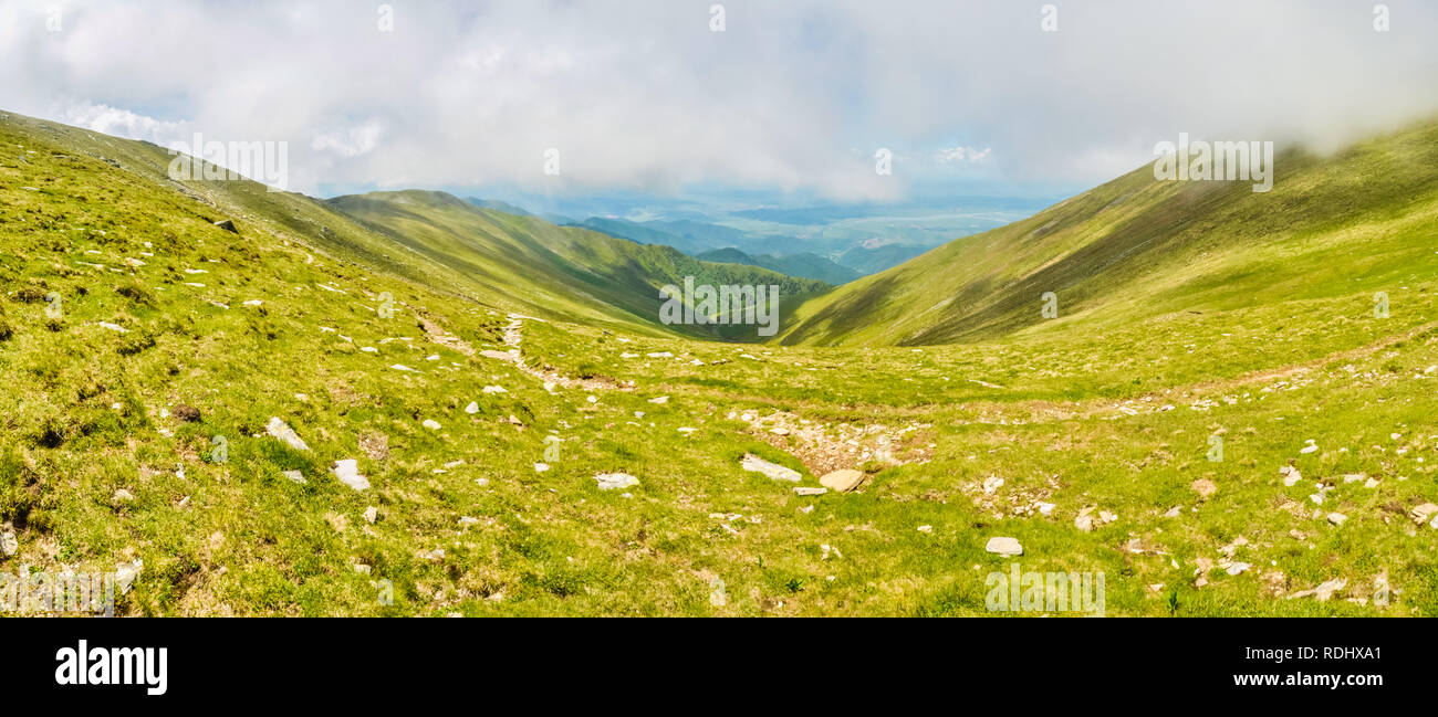 Scenic panorama of rolling hills in mountains of Romania. Stock Photo