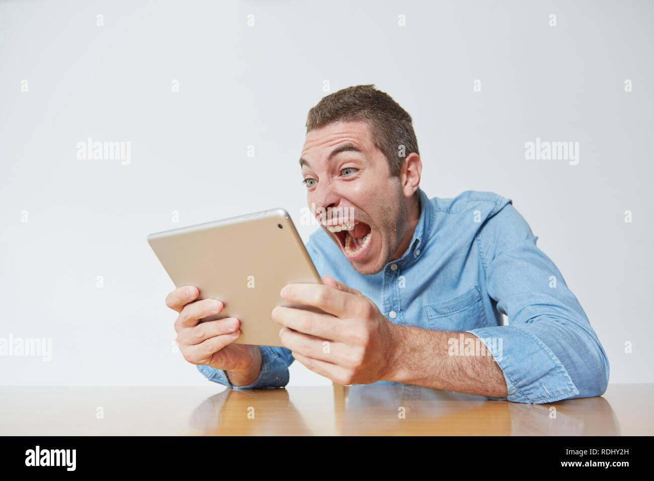Caucasian man using tablet Stock Photo