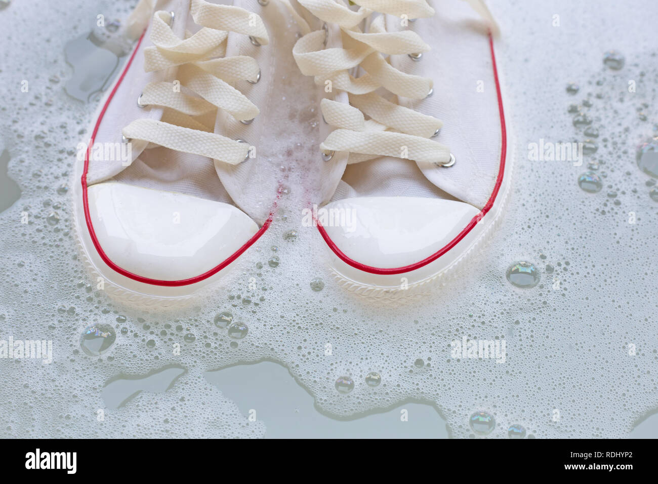 Soak shoes before washing. Cleaning Dirty sneakers Stock Photo Alamy