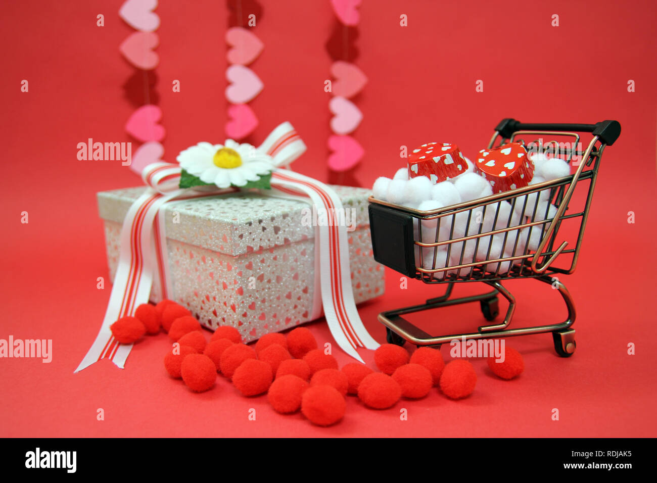 Gift box with red theme Stock Photo - Alamy