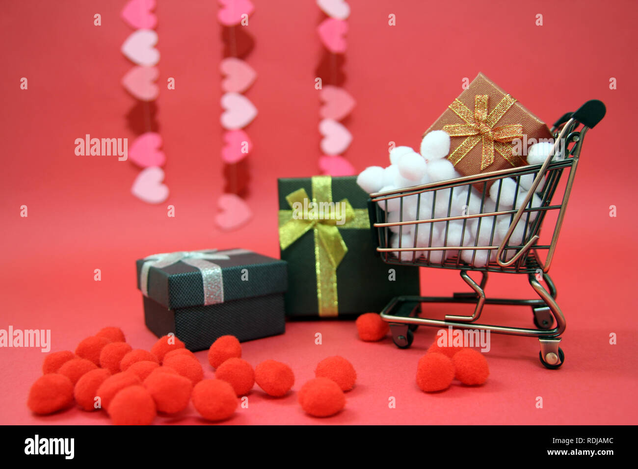 Gift box with red theme Stock Photo - Alamy