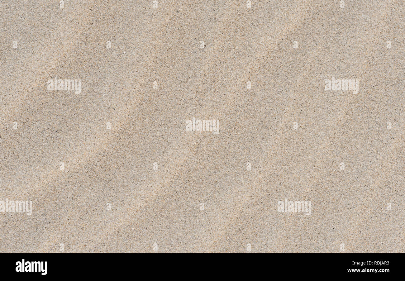 Ripple on the sand. Nature cream background. Sand of Danang My Khe beach, Vietnam. Stock Photo