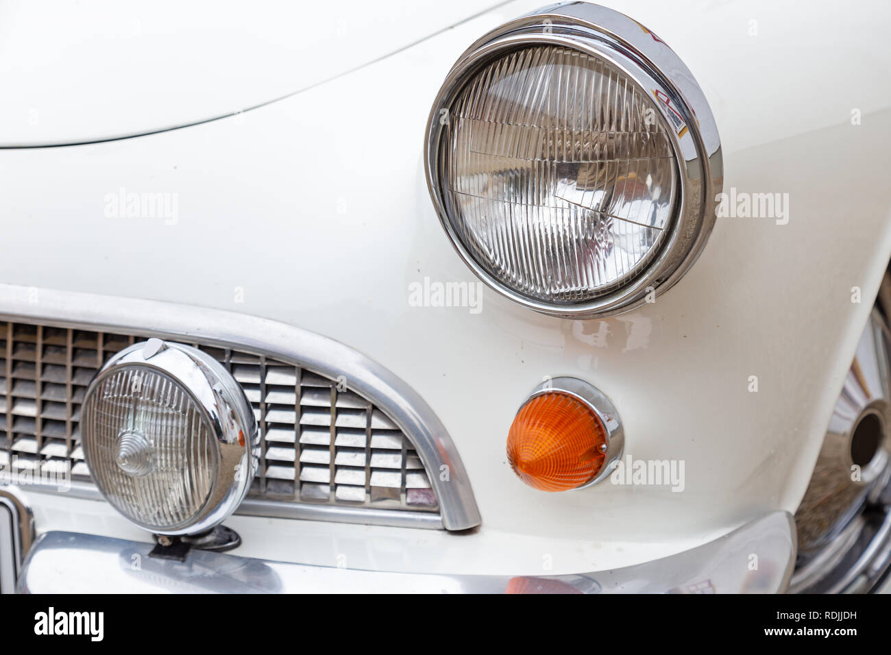 Headlight and turn signal of a German sports car of the sixties Stock Photo
