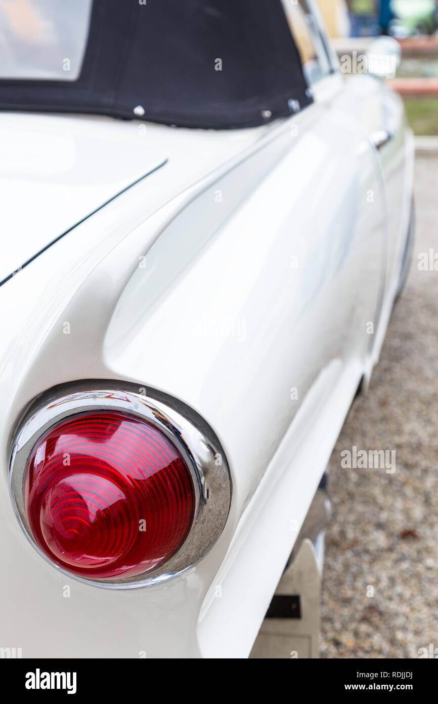 Round tail light of a German sports car of the sixties Stock Photo