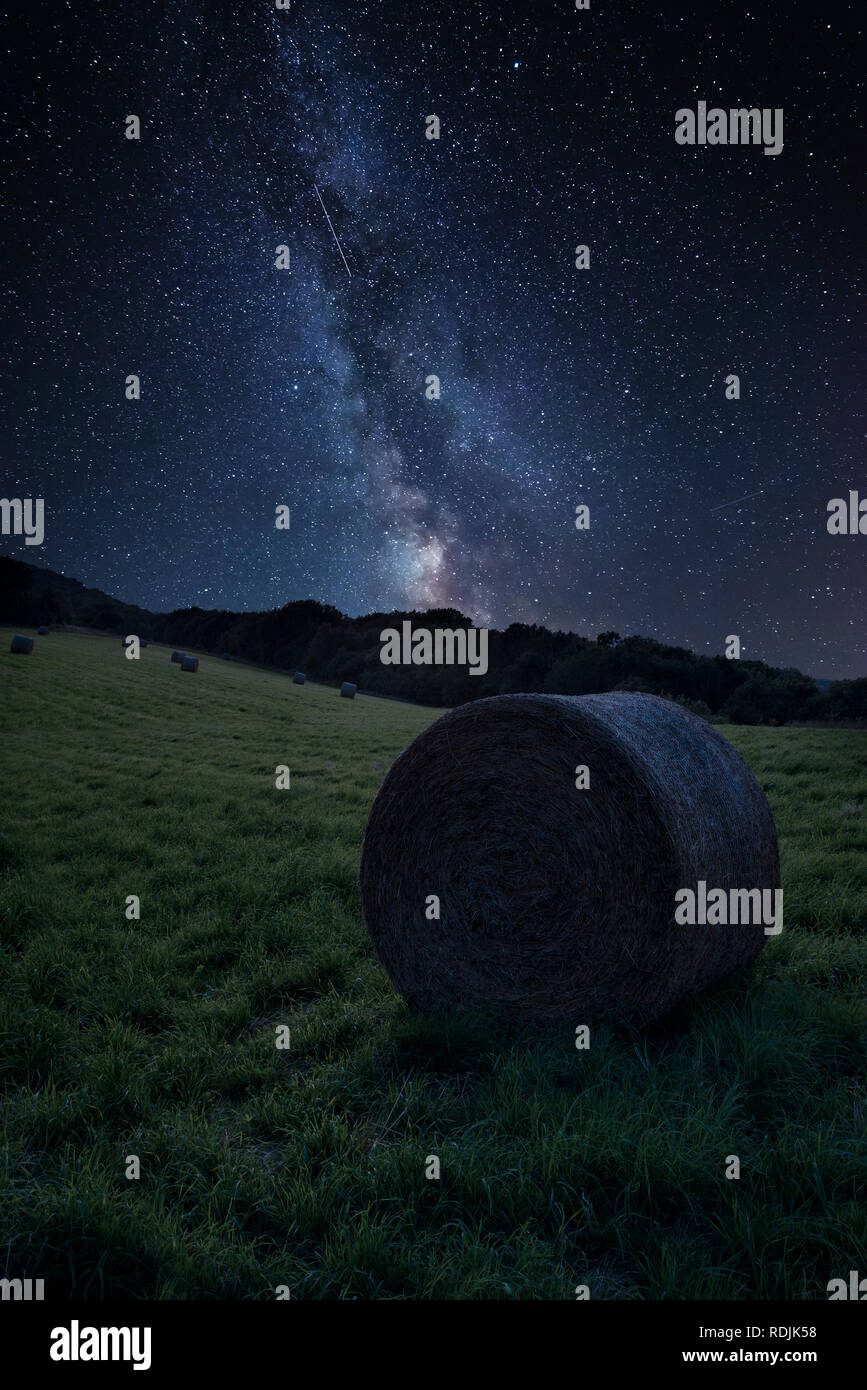 Stunning vibrant Milky Way composite image over landscape of Summer ...