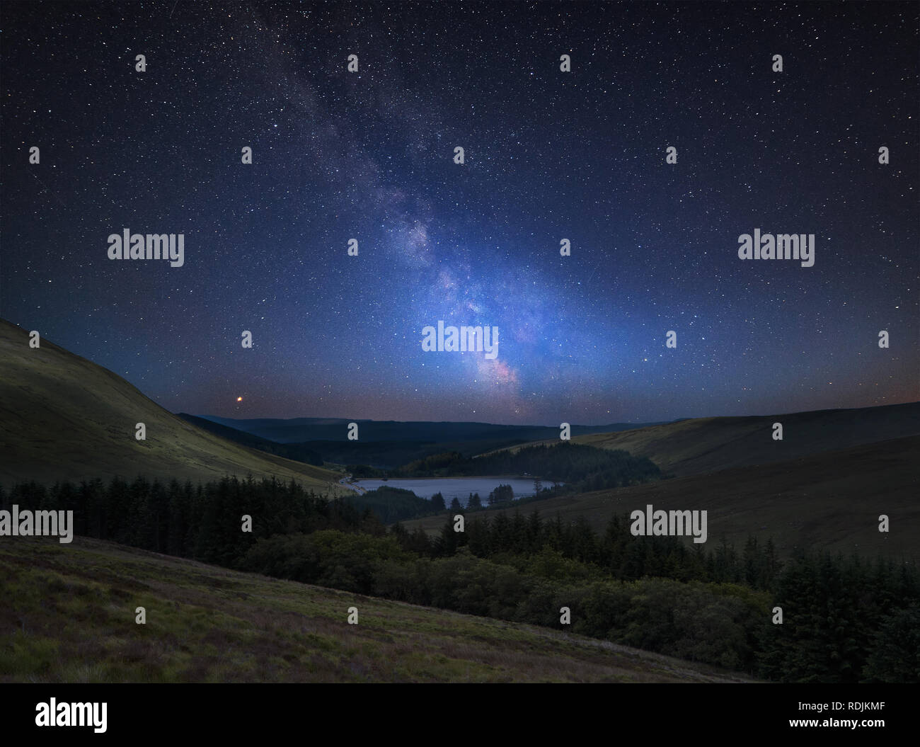 Stunning vibrant Milky Way composite image over landscape of mountains ...