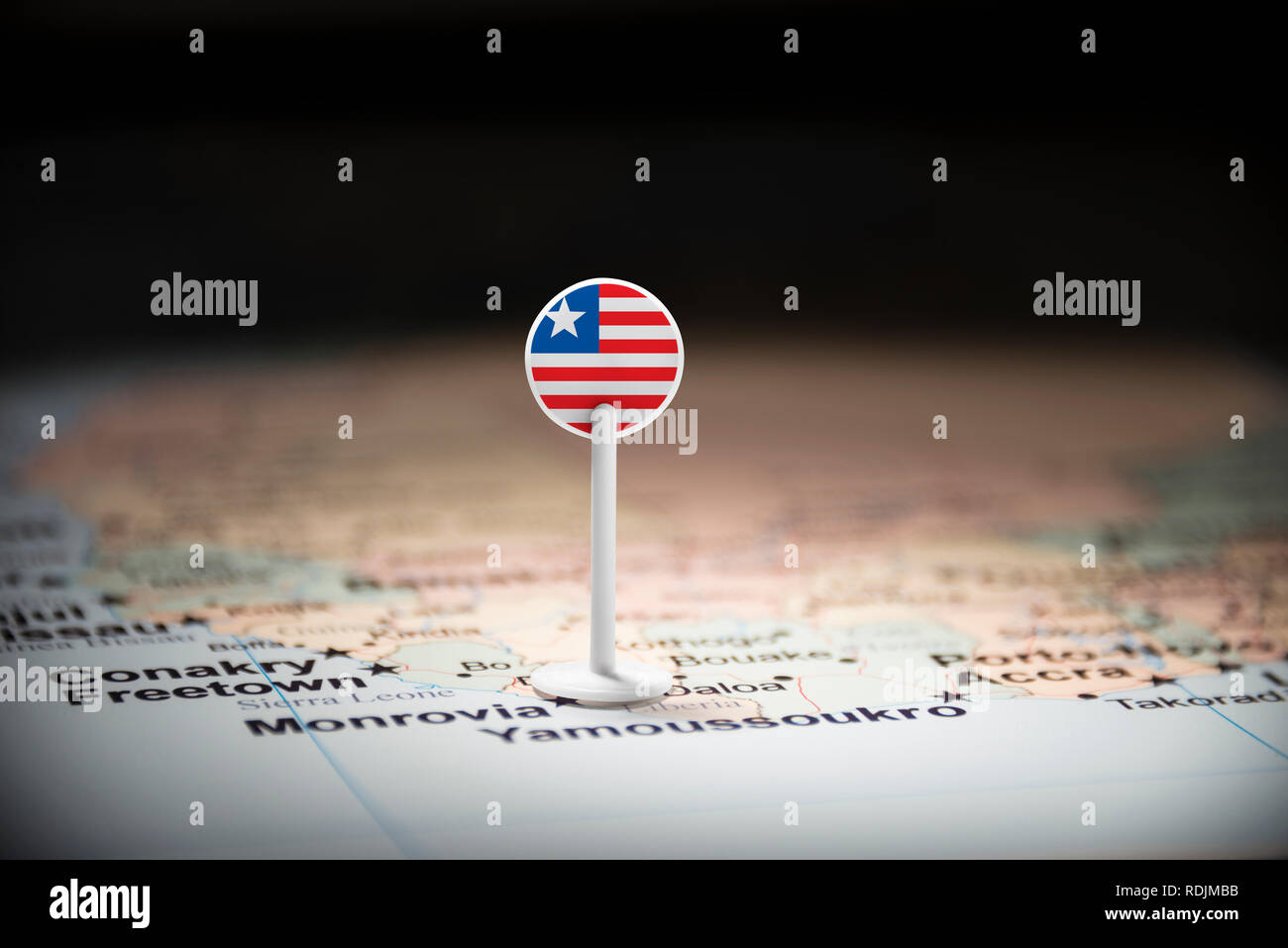 Liberia marked with a flag on the map Stock Photo - Alamy