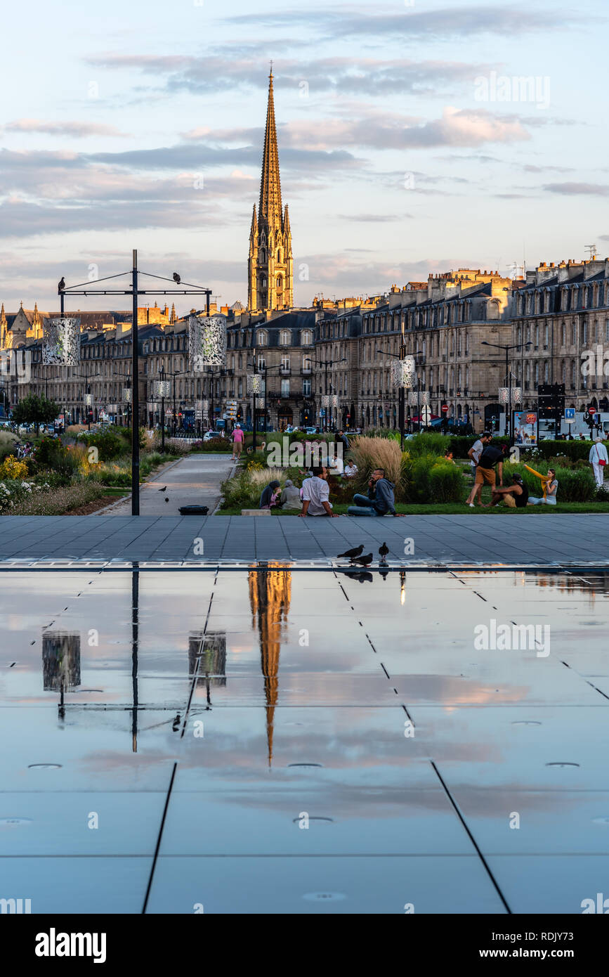Bordeaux, France - July 22, 2018: The Water Mirror at sunset. Located across from Place de la Bourse, this pool alternates a mirror effect and artific Stock Photo