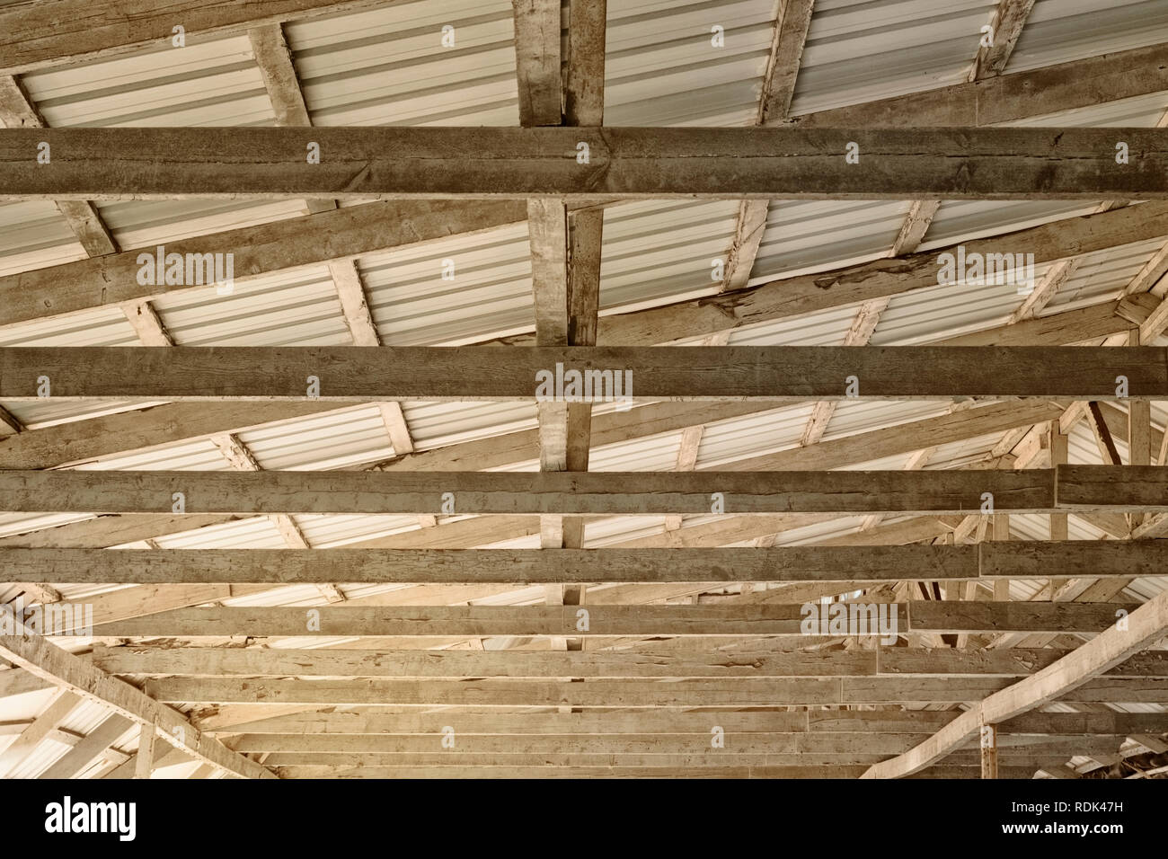 Dome made of tin gray sheets and wooden beams on a Sunny day Stock Photo