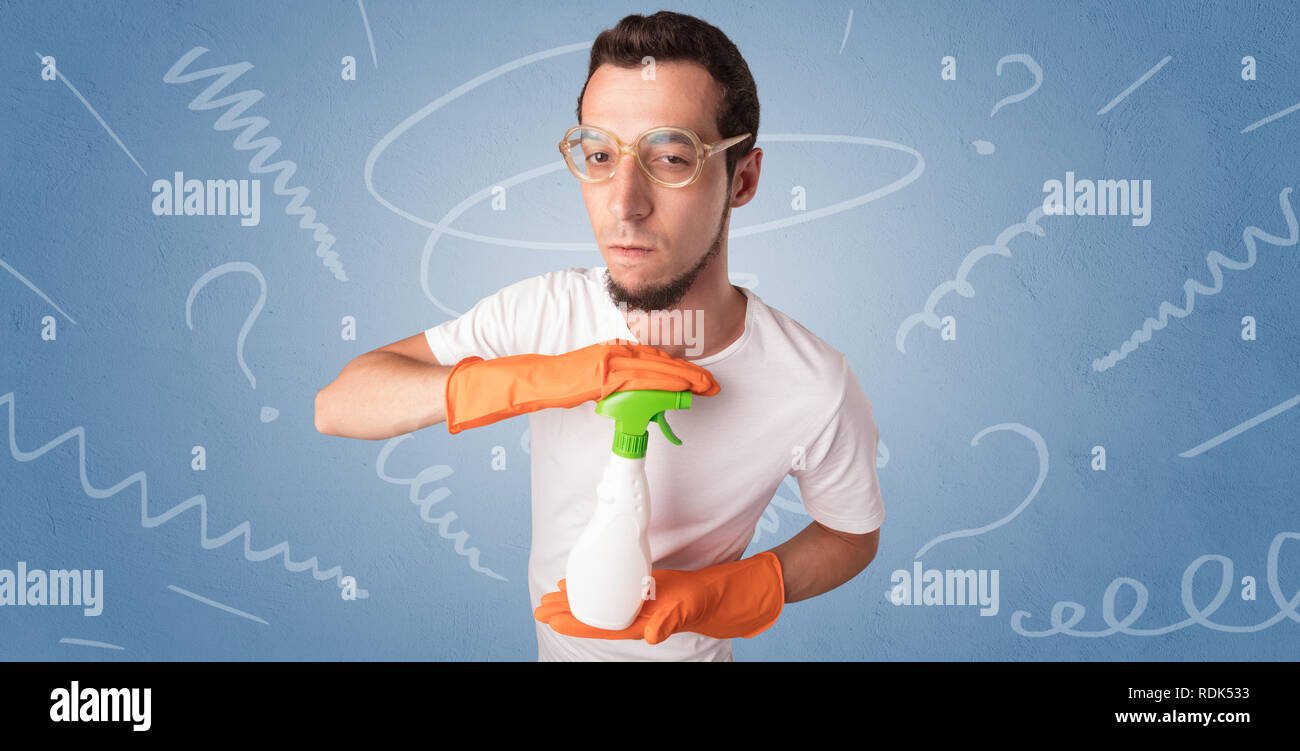 Swabber with orange rubber gloves and doodle concept on wallpaper  Stock Photo