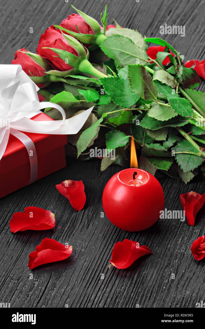 Valentine's Day background with a bouquet of beautiful red roses, gift ...