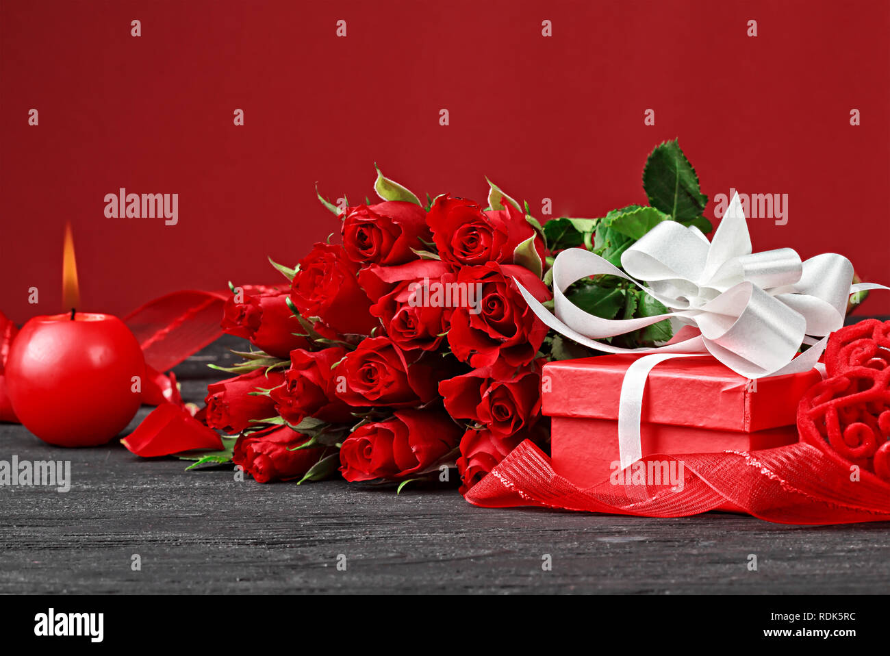 Valentine's Day background with a bouquet of beautiful red roses, gift ...