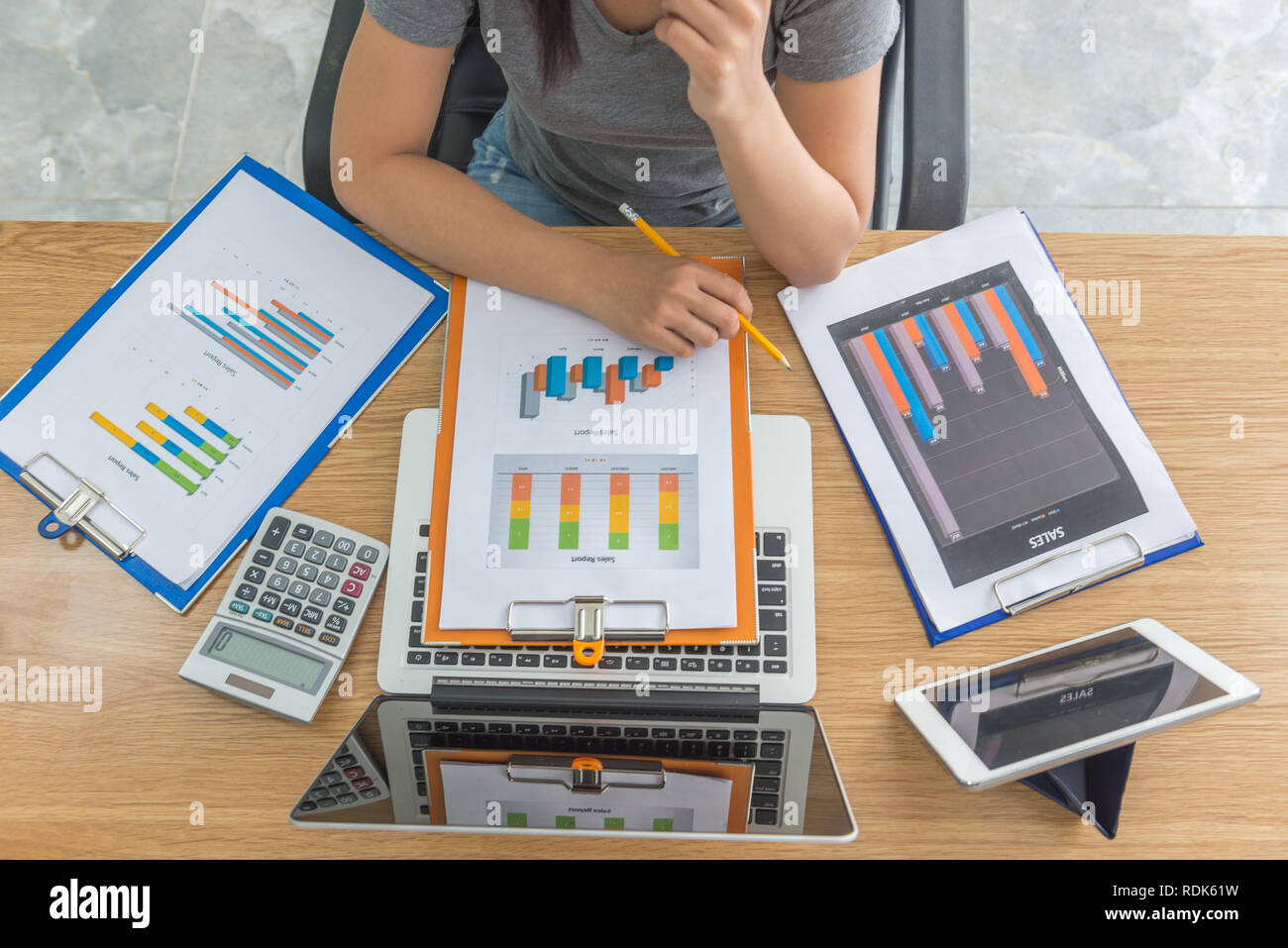 Sales manager reading financial sales report data Stock Photo Alamy