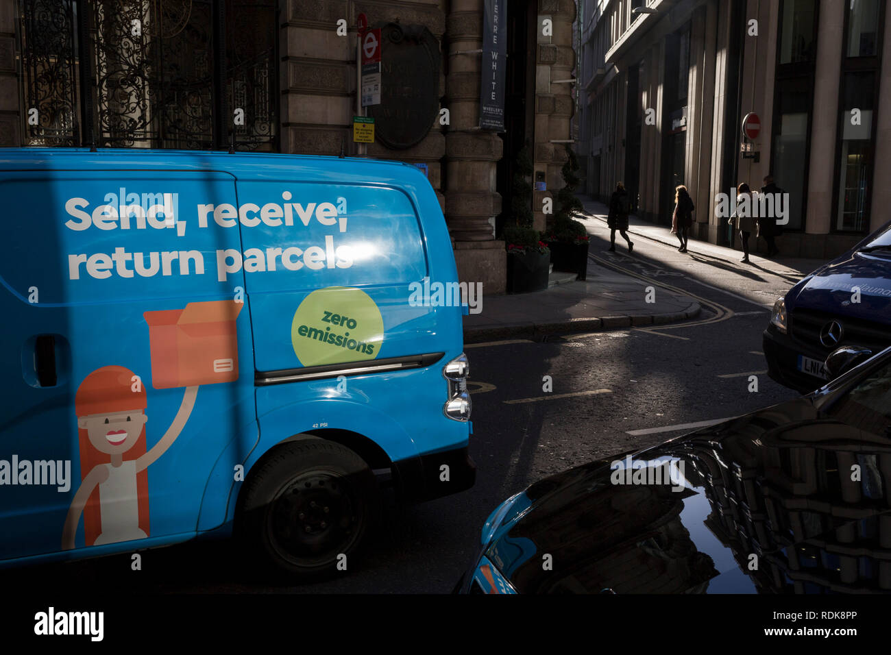 A zero emissions courier delivery van drives through the City of London - aka the Square Mile - the capital's financial district, on 17th January 2019, in London, England. Stock Photo