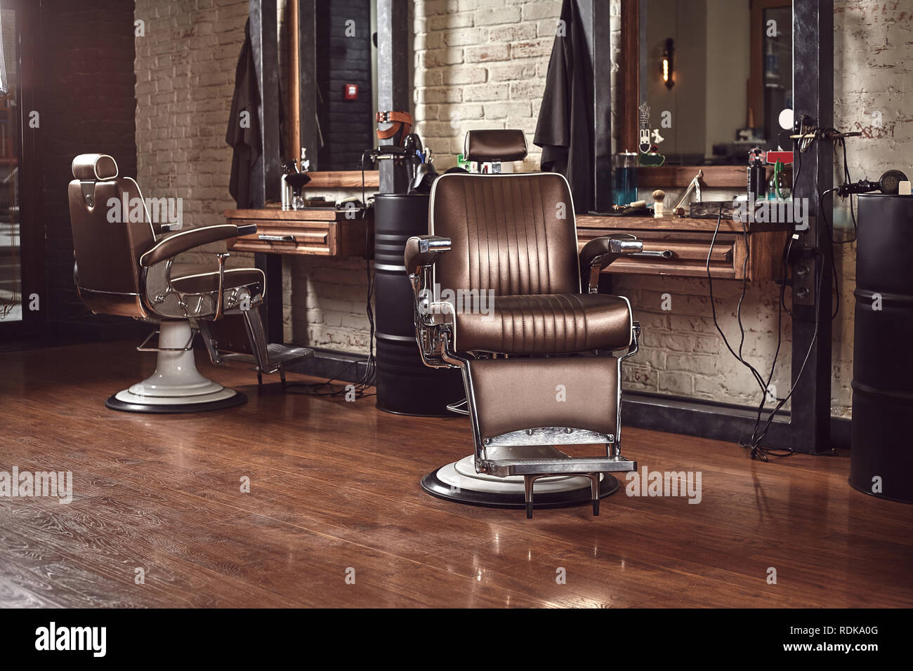 Barbershop brown armchair. Modern hairdresser and hair salon, barber shop  for men Stock Photo - Alamy