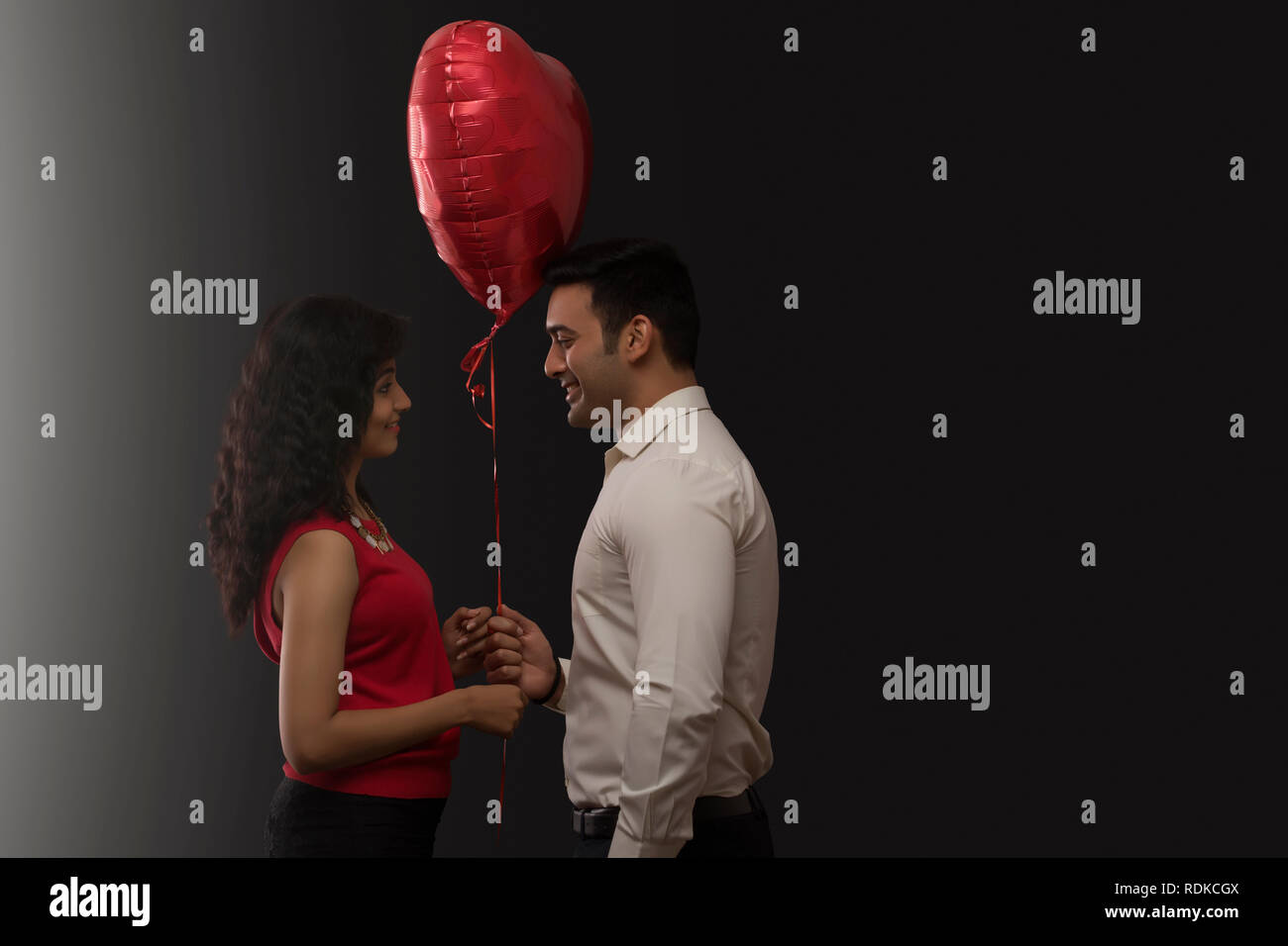 Couple holding heart hi-res stock photography and images - Alamy