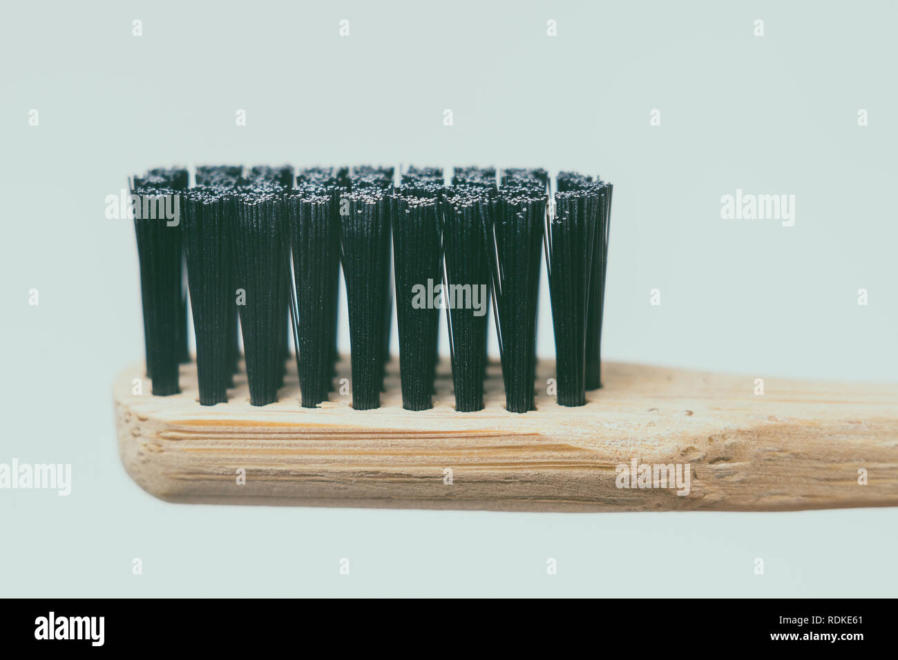 Bamboo toothbrush, closeup view, isolated on white background Stock Photo