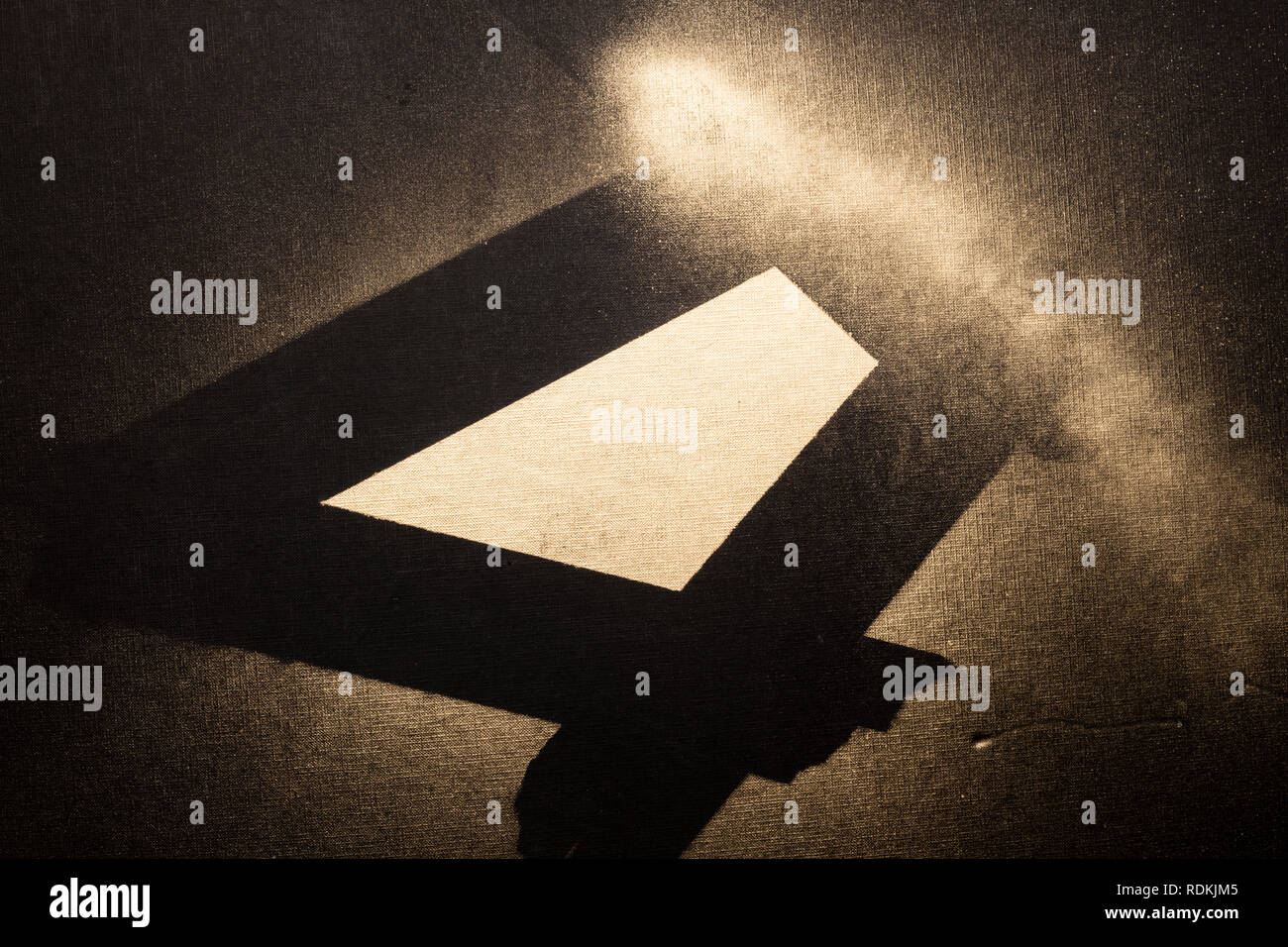 Golden abstract composition on black surface made with spray. Stock Photo