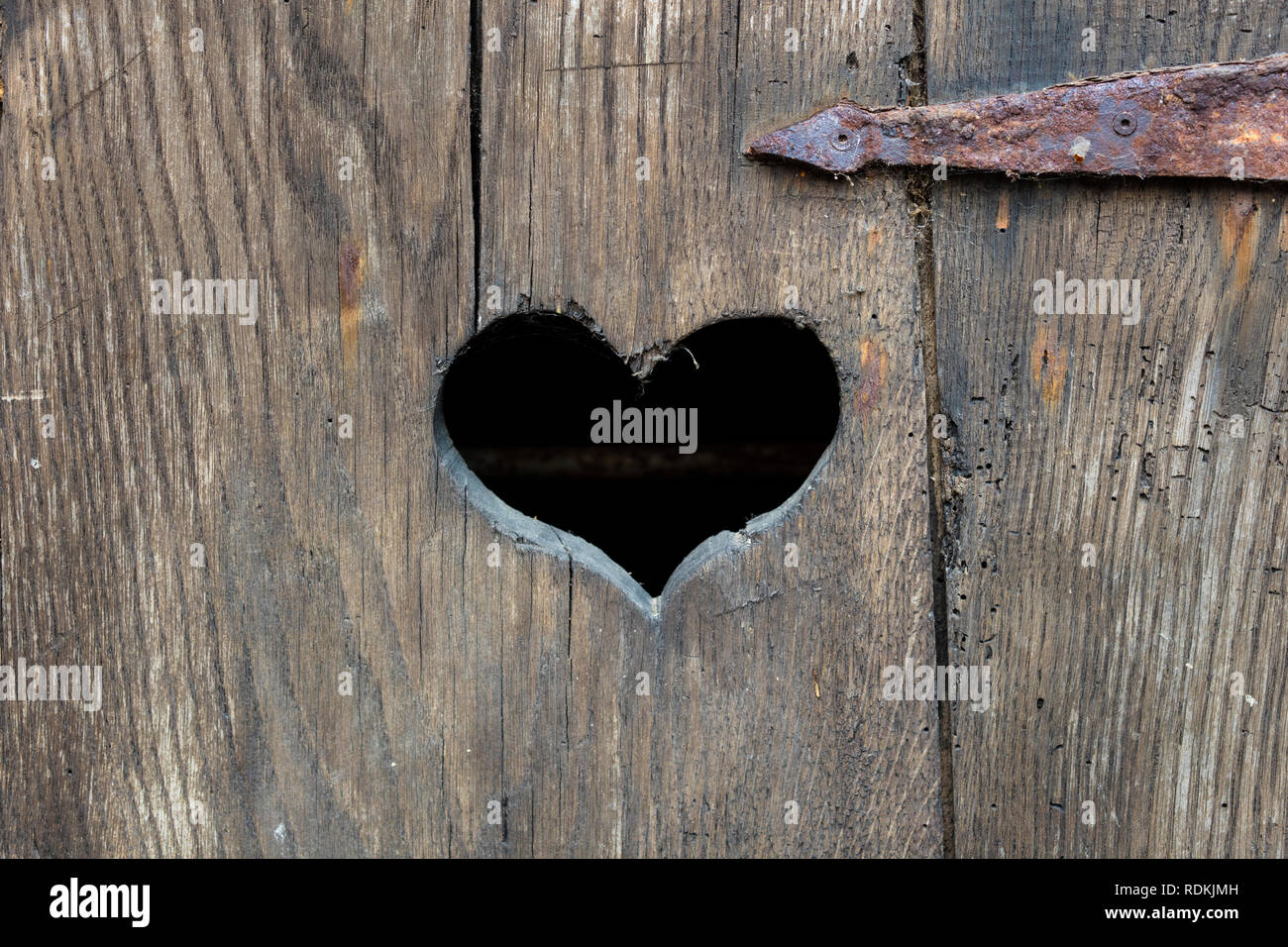 Heart shape on an old door. Stock Photo