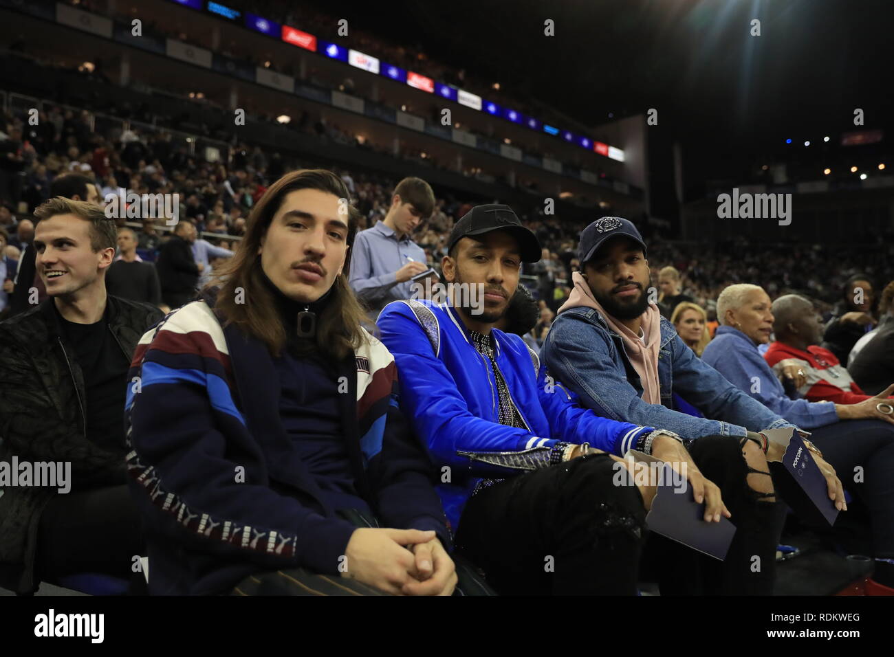 (From left to right) Hector Bellerin, Pierre-Emerick Aubameyang and Alexandre Lacazette in the crowd during the NBA London Game 2019 at the O2 Arena, London Stock Photo