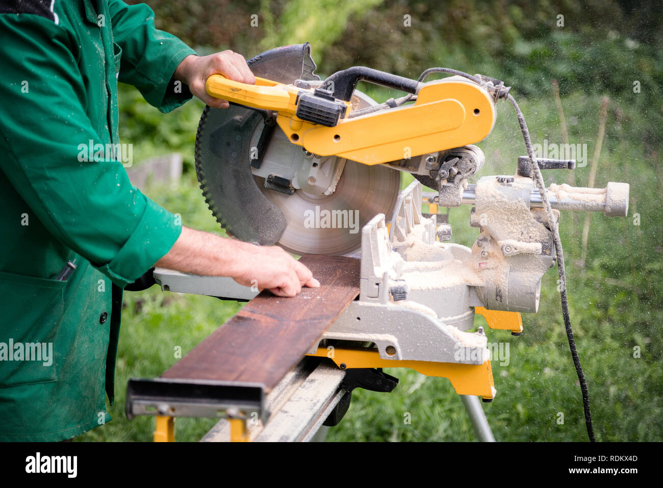 Master carpenter at work in the outdoors. Carpenter hand