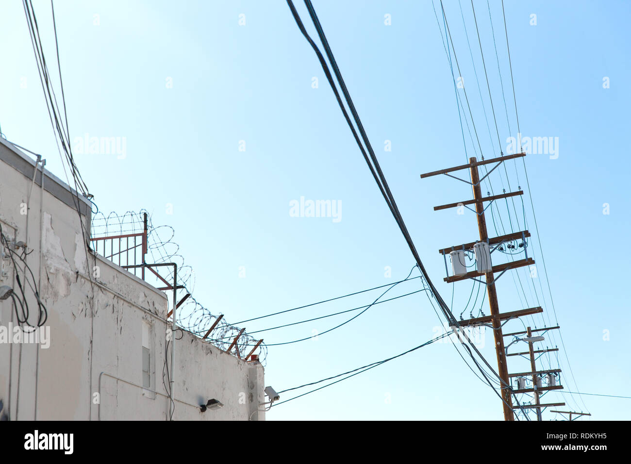 transmission tower and power line over blue sky Stock Photo - Alamy