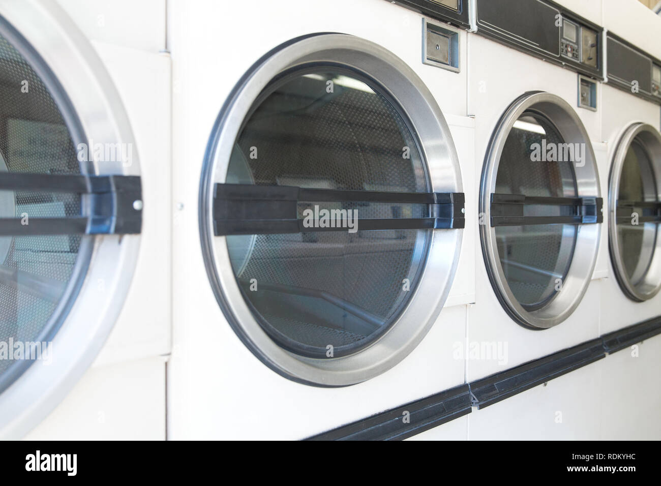 washing machines at laundromat Stock Photo