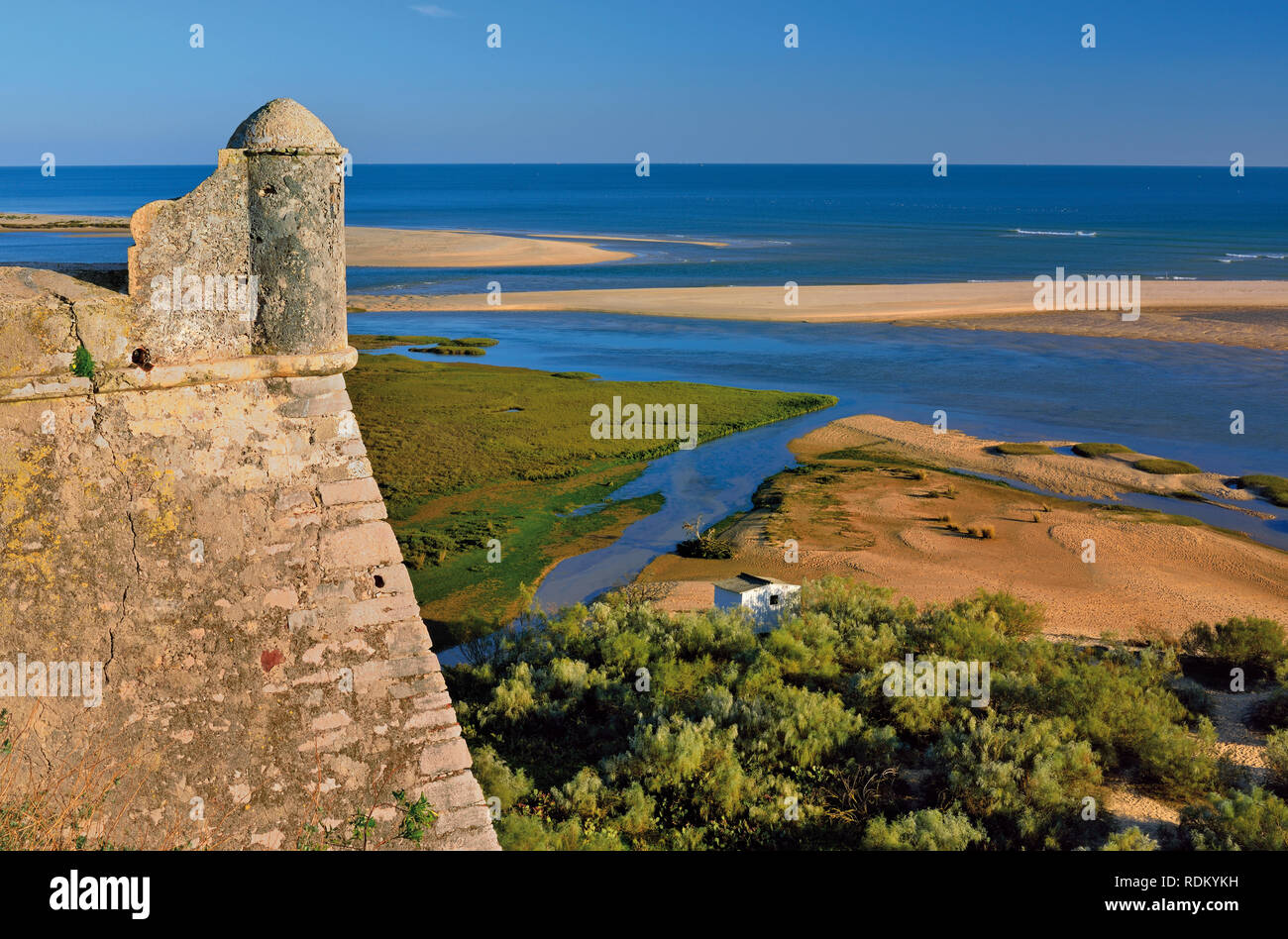 Watch tower of medieveal fortress overlooking coastal landscape with barrier islands and lagoons Stock Photo
