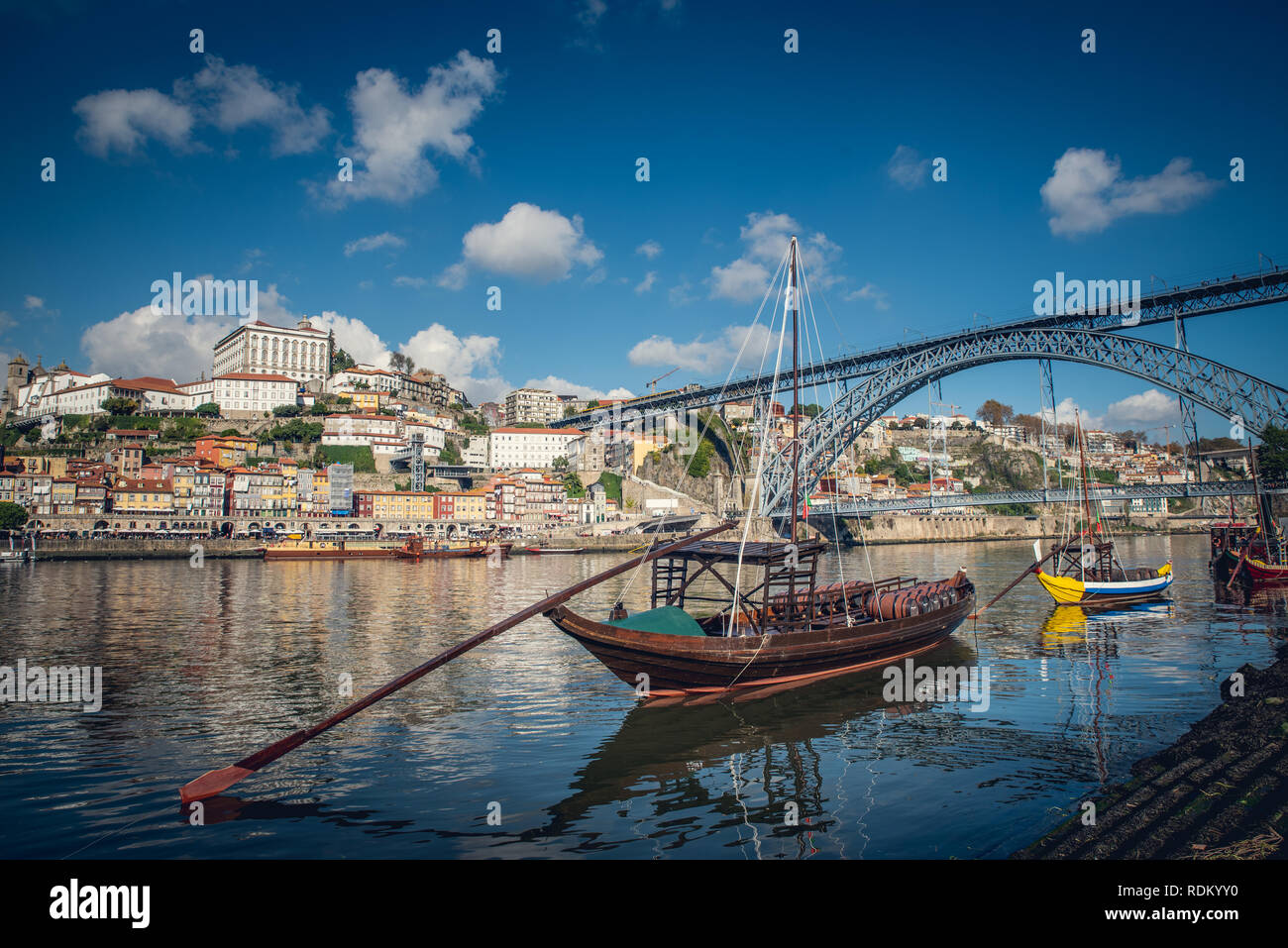 Port wine storage warehouses and transport boats at river Duoro in Vila Nova de Gaia opposite