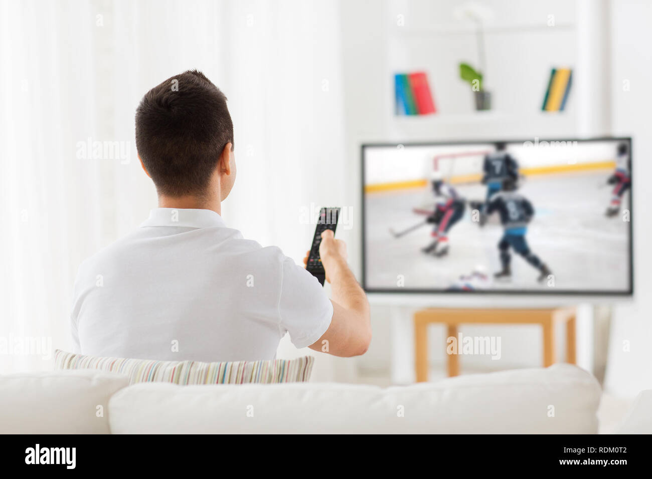 Man watching tv sport hi-res stock photography and images - Alamy