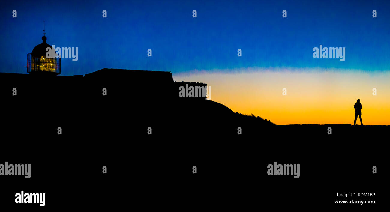 silhouette of one person at cape st. vincent lighthouse at dusk, Stock Photo