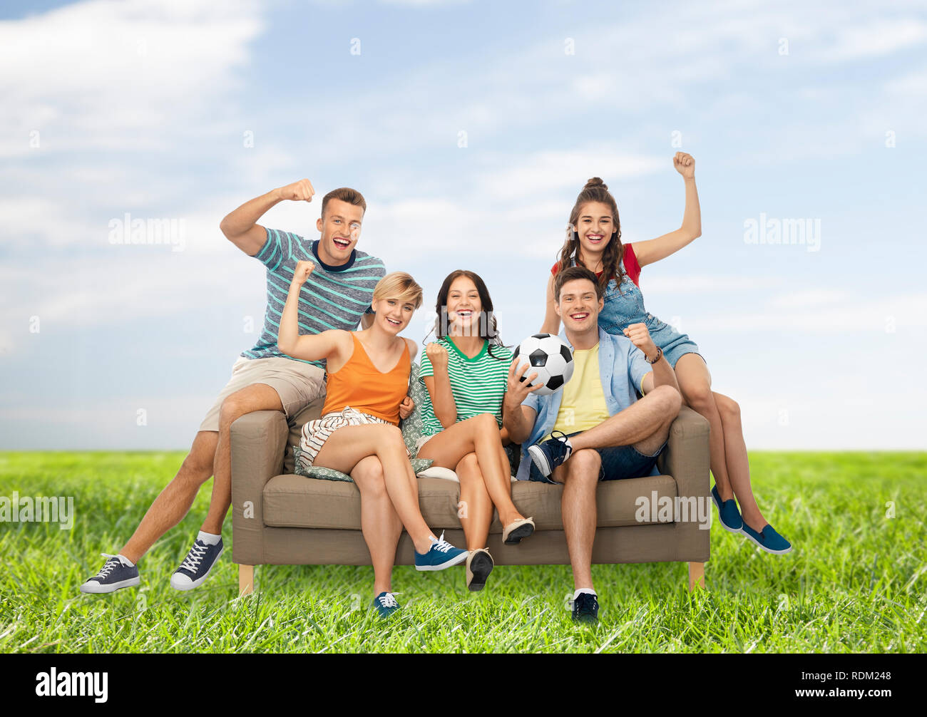 friends or football fans friends with soccer ball Stock Photo Alamy