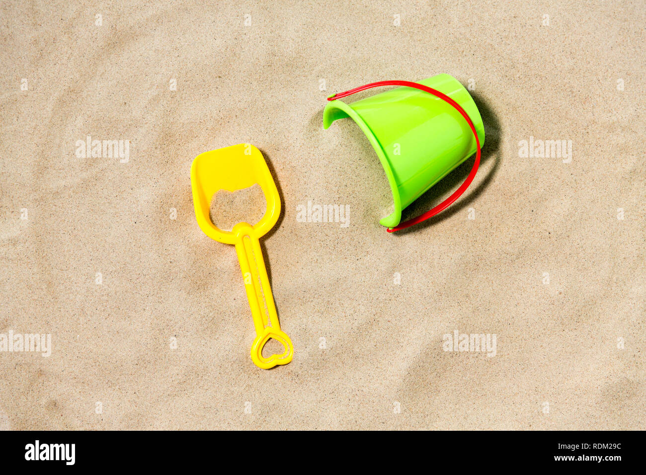 toy bucket and shovel on beach sand Stock Photo Alamy