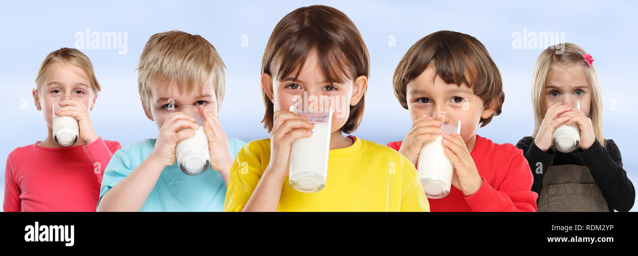 Group of children girl boy drinking milk kids glass healthy eating banner young Stock Photo