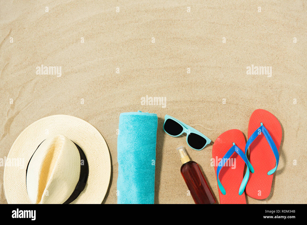 straw hat, flip flops and sunglasses on beach sand Stock Photo - Alamy