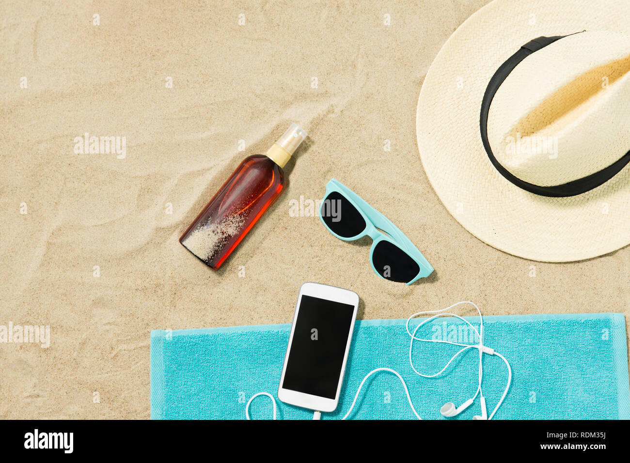 smartphone, hat, flip flops and shades on beach Stock Photo - Alamy