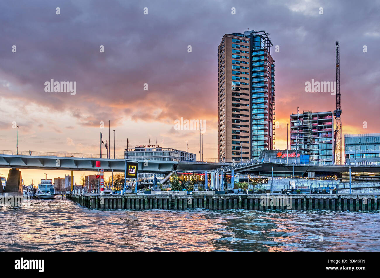 Rotterdam, The Netherlands, December 4, 2018: the Erasmus bridge head with the Prachtig restaurant underneath and residential buildings behind it unde Stock Photo