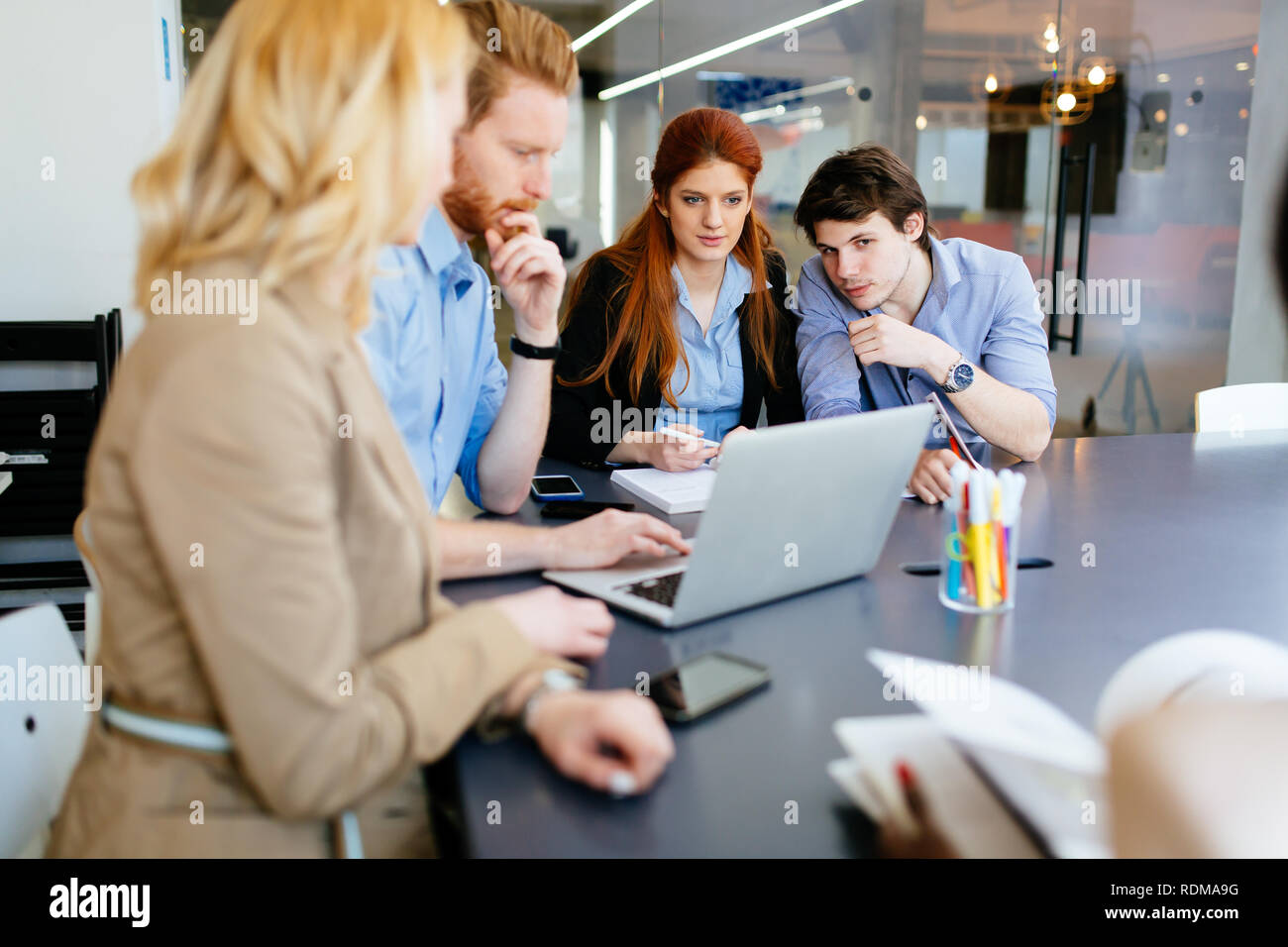 Business people collaborating in office and working on project together Stock Photo