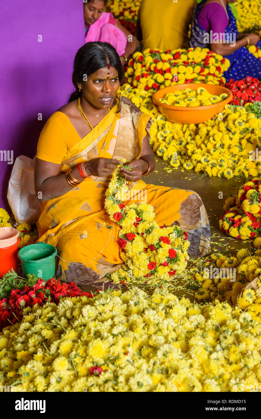 Women making flower garlands for sale, Krishnarajendra market